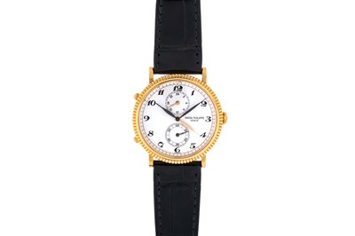 Lot 412 - Patek Philippe - 18k Gold Dual Time Wristwatch