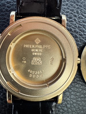 Lot 412 - Patek Philippe - 18k Gold Dual Time Wristwatch