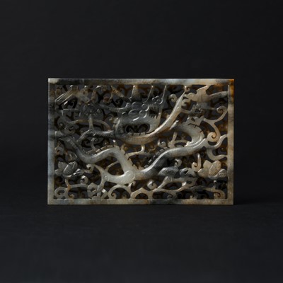 Lot 108 - A Chinese grey jade 'dragon' plaque, late Qing dynasty