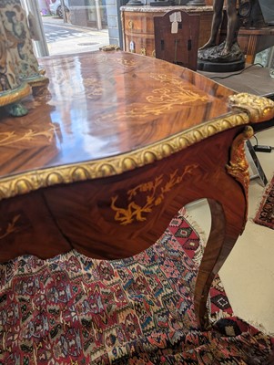Lot 341 - A Louis XV style kingwood and marquetry bureau plat