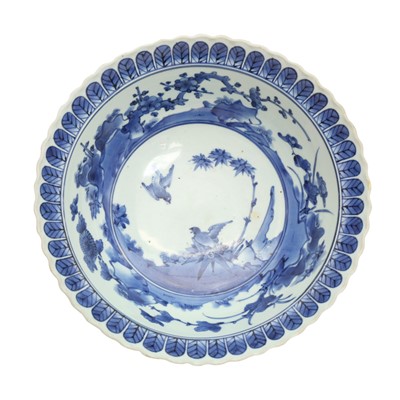 Lot 15 - A Japanese Kakiemon blue and white 'sparrows' bowl, Edo period, 17th century
