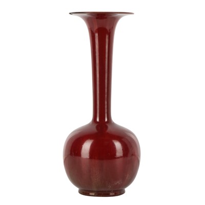 Lot 21 - A Japanese red-glazed ikebana vase, Showa era