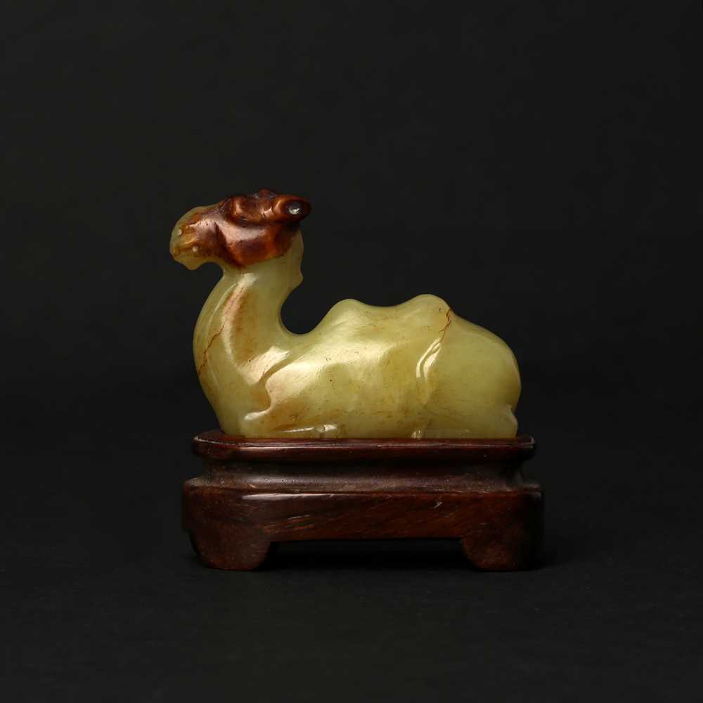 Lot 83 - A Chinese yellow jade carving of a camel, Qing dynasty