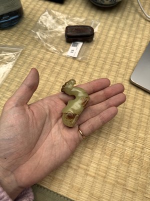 Lot 83 - A Chinese yellow jade carving of a camel, Qing dynasty