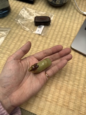 Lot 83 - A Chinese yellow jade carving of a camel, Qing dynasty