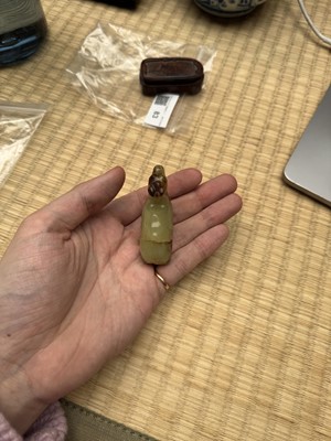 Lot 83 - A Chinese yellow jade carving of a camel, Qing dynasty