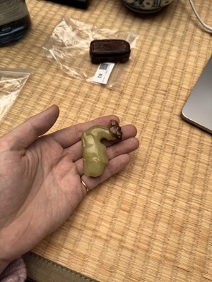 Lot 83 - A Chinese yellow jade carving of a camel, Qing dynasty