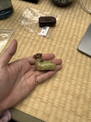 Lot 83 - A Chinese yellow jade carving of a camel, Qing dynasty