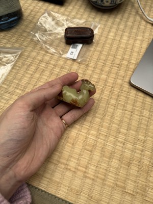 Lot 83 - A Chinese yellow jade carving of a camel, Qing dynasty