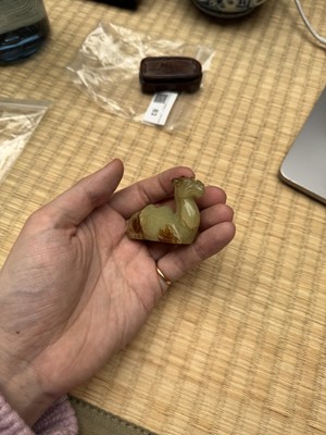 Lot 83 - A Chinese yellow jade carving of a camel, Qing dynasty