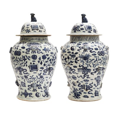 Lot 303 - A pair of Chinese blue and white vases and covers, 20th century