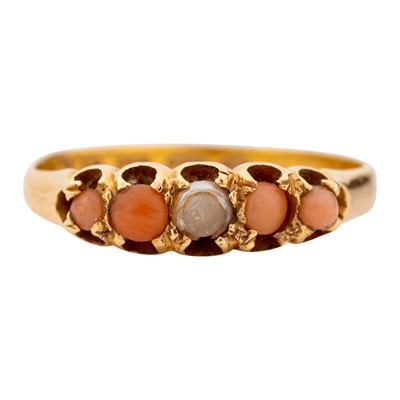 Lot 49 - A coral and seed pearl five stone ring