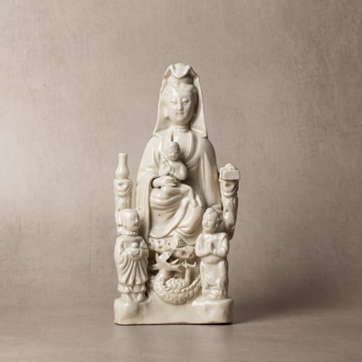 Lot 34 - A Chinese Dehua 'Songzi Guanyin' figure group, Qing dynasty, Kangxi period