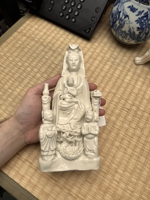 Lot 34 - A Chinese Dehua 'Songzi Guanyin' figure group, Qing dynasty, Kangxi period