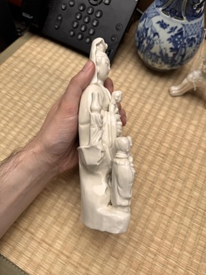 Lot 34 - A Chinese Dehua 'Songzi Guanyin' figure group, Qing dynasty, Kangxi period