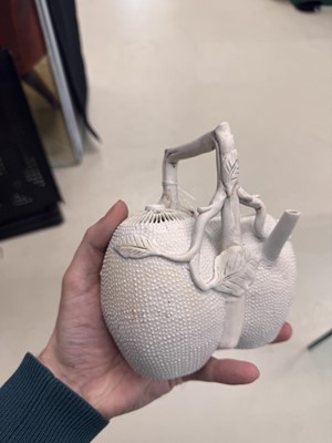 Lot 36 - A rare Chinese biscuit 'double peach' teapot, Qing dynasty, Yongzheng period