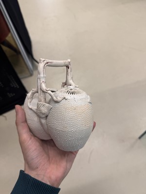 Lot 36 - A rare Chinese biscuit 'double peach' teapot, Qing dynasty, Yongzheng period