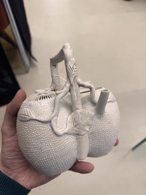 Lot 36 - A rare Chinese biscuit 'double peach' teapot, Qing dynasty, Yongzheng period