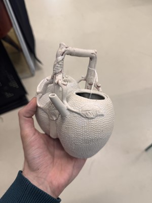 Lot 36 - A rare Chinese biscuit 'double peach' teapot, Qing dynasty, Yongzheng period