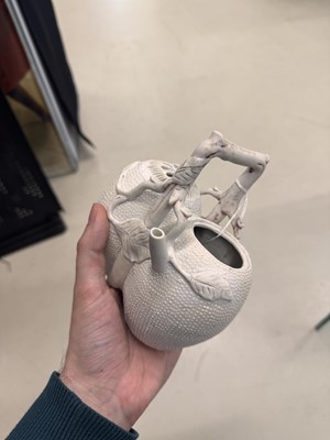 Lot 36 - A rare Chinese biscuit 'double peach' teapot, Qing dynasty, Yongzheng period