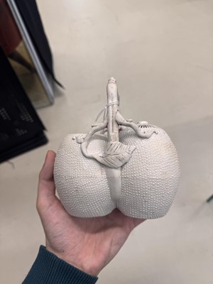 Lot 36 - A rare Chinese biscuit 'double peach' teapot, Qing dynasty, Yongzheng period