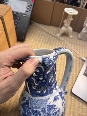 Lot 18 - A rare Chinese export blue and white 'puzzle' jug, Qing dynasty, Kangxi period
