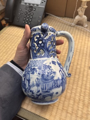 Lot 18 - A rare Chinese export blue and white 'puzzle' jug, Qing dynasty, Kangxi period