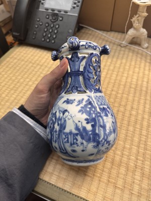 Lot 18 - A rare Chinese export blue and white 'puzzle' jug, Qing dynasty, Kangxi period