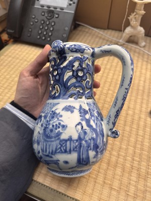 Lot 18 - A rare Chinese export blue and white 'puzzle' jug, Qing dynasty, Kangxi period