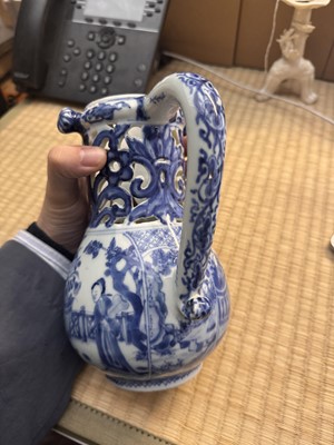 Lot 18 - A rare Chinese export blue and white 'puzzle' jug, Qing dynasty, Kangxi period