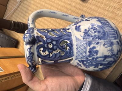 Lot 18 - A rare Chinese export blue and white 'puzzle' jug, Qing dynasty, Kangxi period