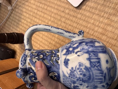 Lot 18 - A rare Chinese export blue and white 'puzzle' jug, Qing dynasty, Kangxi period