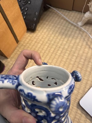 Lot 18 - A rare Chinese export blue and white 'puzzle' jug, Qing dynasty, Kangxi period