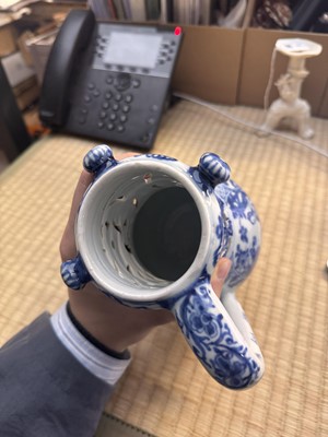 Lot 18 - A rare Chinese export blue and white 'puzzle' jug, Qing dynasty, Kangxi period