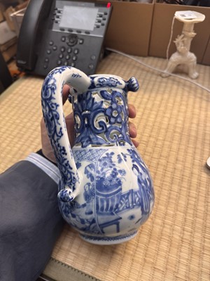 Lot 18 - A rare Chinese export blue and white 'puzzle' jug, Qing dynasty, Kangxi period
