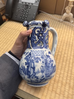 Lot 18 - A rare Chinese export blue and white 'puzzle' jug, Qing dynasty, Kangxi period