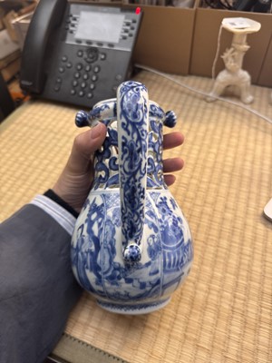 Lot 18 - A rare Chinese export blue and white 'puzzle' jug, Qing dynasty, Kangxi period