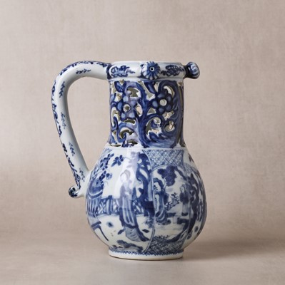 Lot 18 - A rare Chinese export blue and white 'puzzle' jug, Qing dynasty, Kangxi period