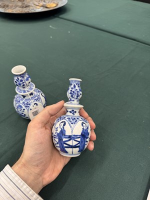Lot 17 - A pair of small Chinese blue and white vases, Qing dynasty, Kangxi period
