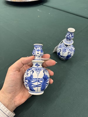 Lot 17 - A pair of small Chinese blue and white vases, Qing dynasty, Kangxi period