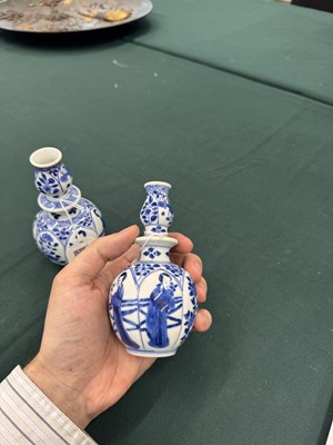 Lot 17 - A pair of small Chinese blue and white vases, Qing dynasty, Kangxi period