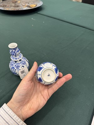 Lot 17 - A pair of small Chinese blue and white vases, Qing dynasty, Kangxi period