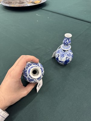 Lot 17 - A pair of small Chinese blue and white vases, Qing dynasty, Kangxi period