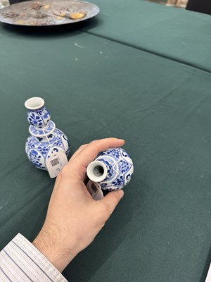 Lot 17 - A pair of small Chinese blue and white vases, Qing dynasty, Kangxi period