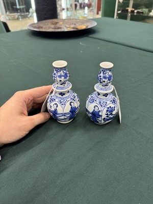 Lot 17 - A pair of small Chinese blue and white vases, Qing dynasty, Kangxi period
