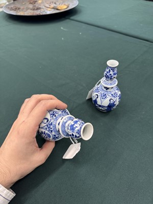 Lot 17 - A pair of small Chinese blue and white vases, Qing dynasty, Kangxi period