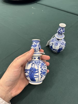 Lot 17 - A pair of small Chinese blue and white vases, Qing dynasty, Kangxi period