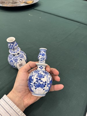 Lot 17 - A pair of small Chinese blue and white vases, Qing dynasty, Kangxi period