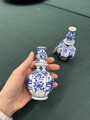 Lot 17 - A pair of small Chinese blue and white vases, Qing dynasty, Kangxi period