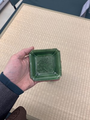 Lot 26 - A pair of small Chinese green-glazed 'dragon' dishes, Qing dynasty, Shunzhi period